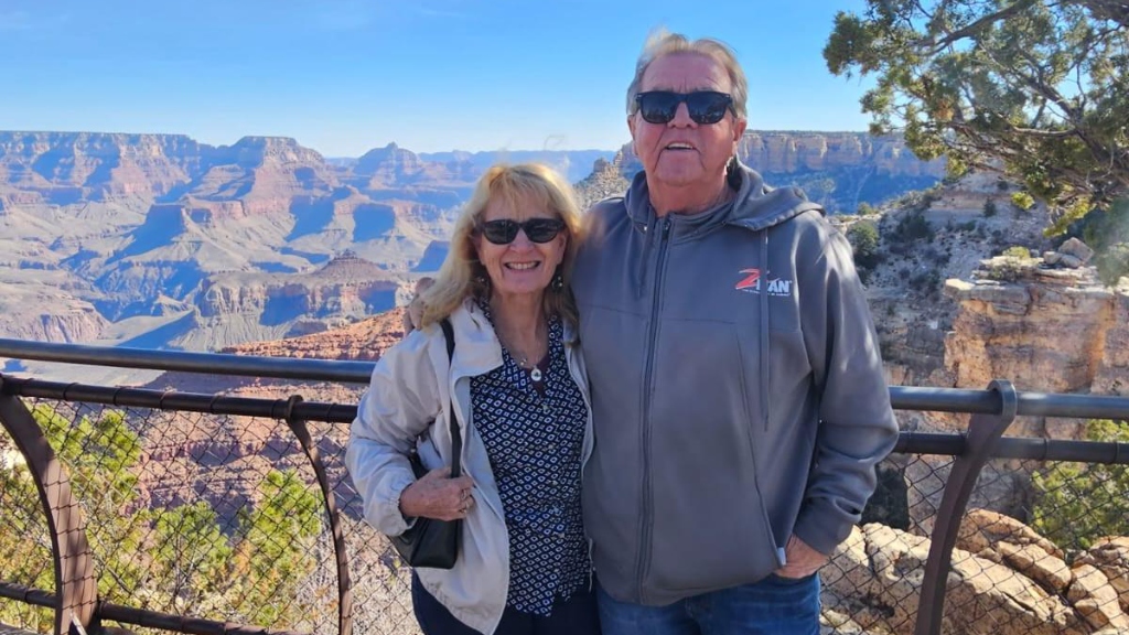 Rick and Terri smiling together at the Grand Canyon